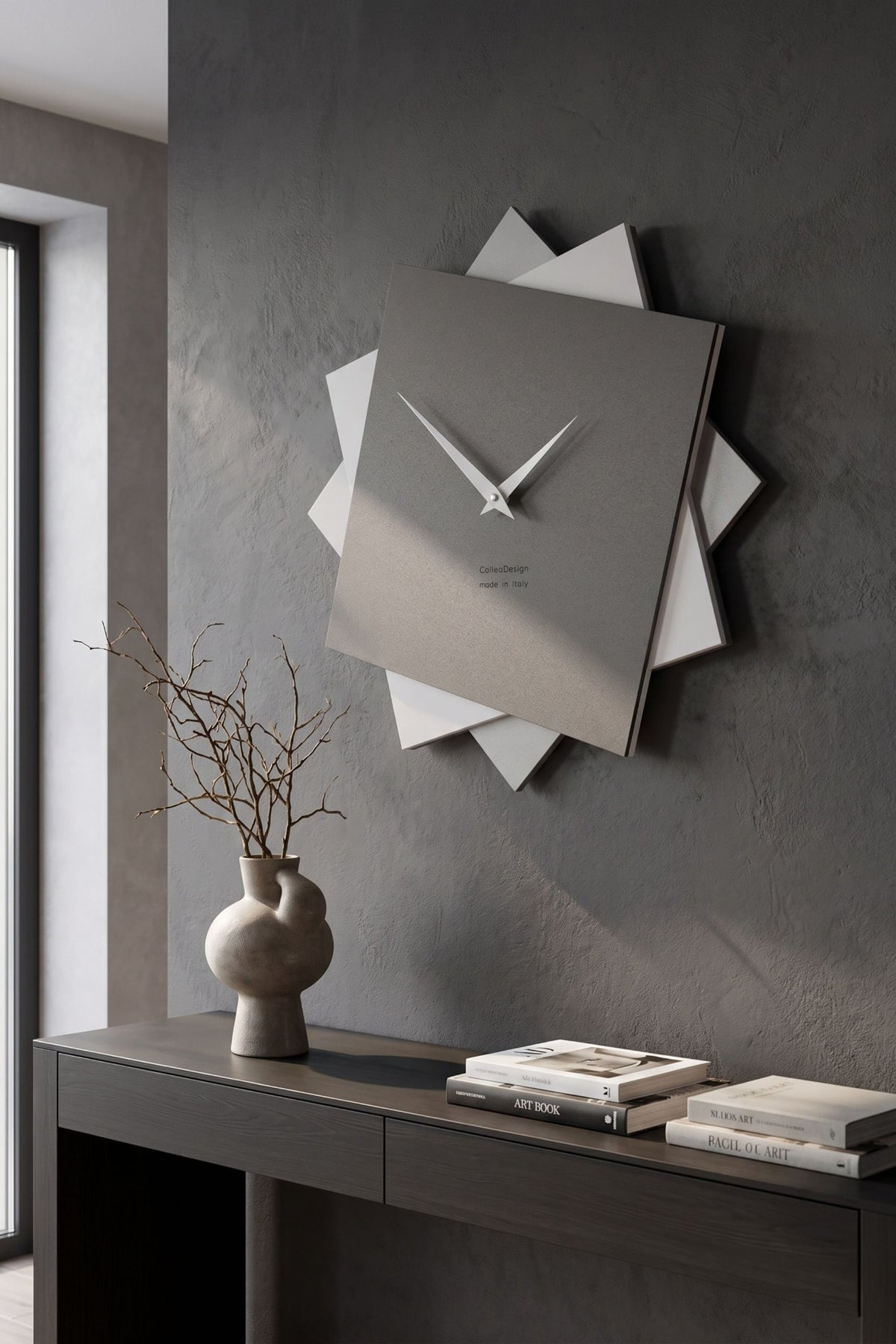 CalleaDesign Foy wall clock in Quartz Grey above a contemporary console