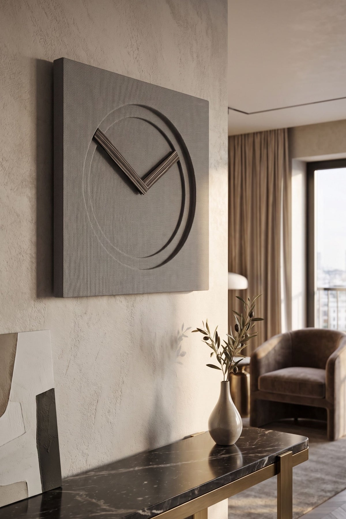 KAM 2 Limited Edition wall clock with textured grey finish on a plaster wall in a contemporary living room