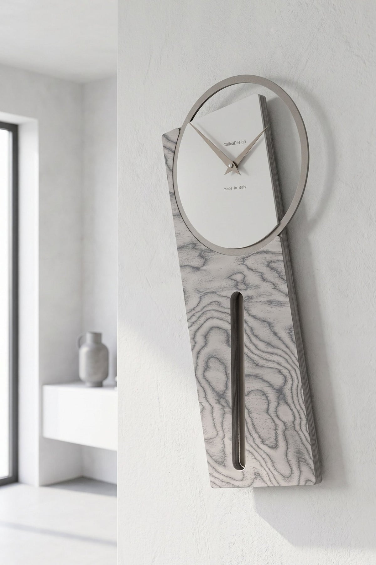 CalleaDesign Sherlock pendulum clock in Sottsass Grey finish in a bright contemporary interior