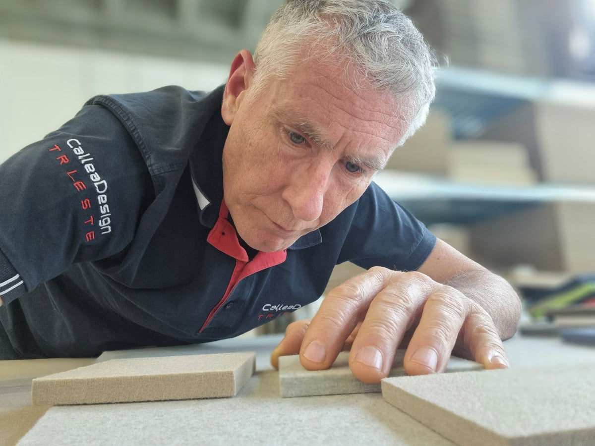 CalleaDesign artisan hand-finishing a clock component in the Italian atelier