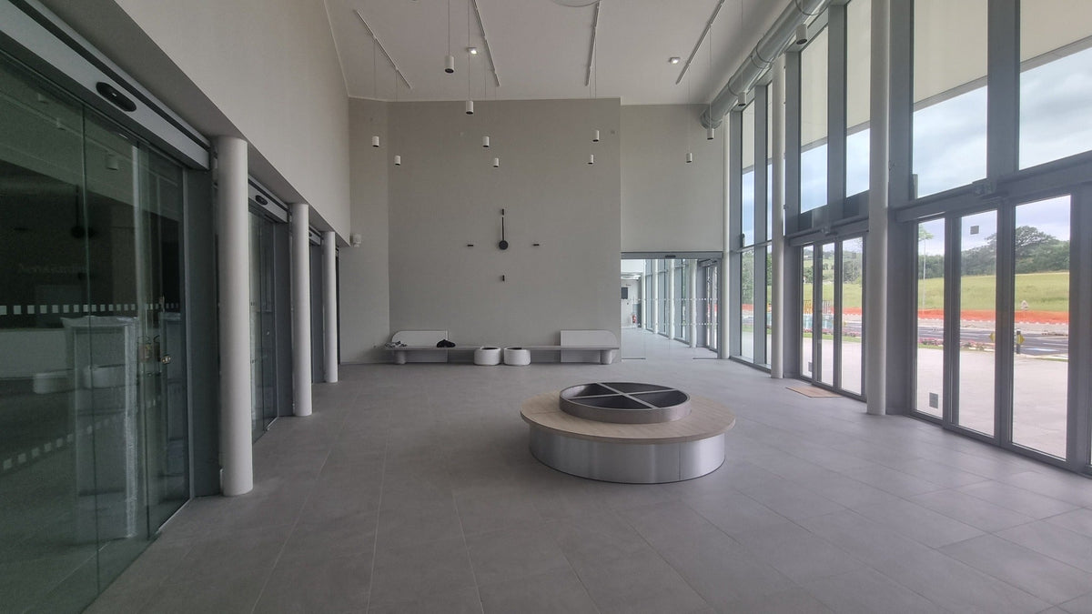 CalleaDesign 190 cm custom wall clock installed in a contemporary architectural hall