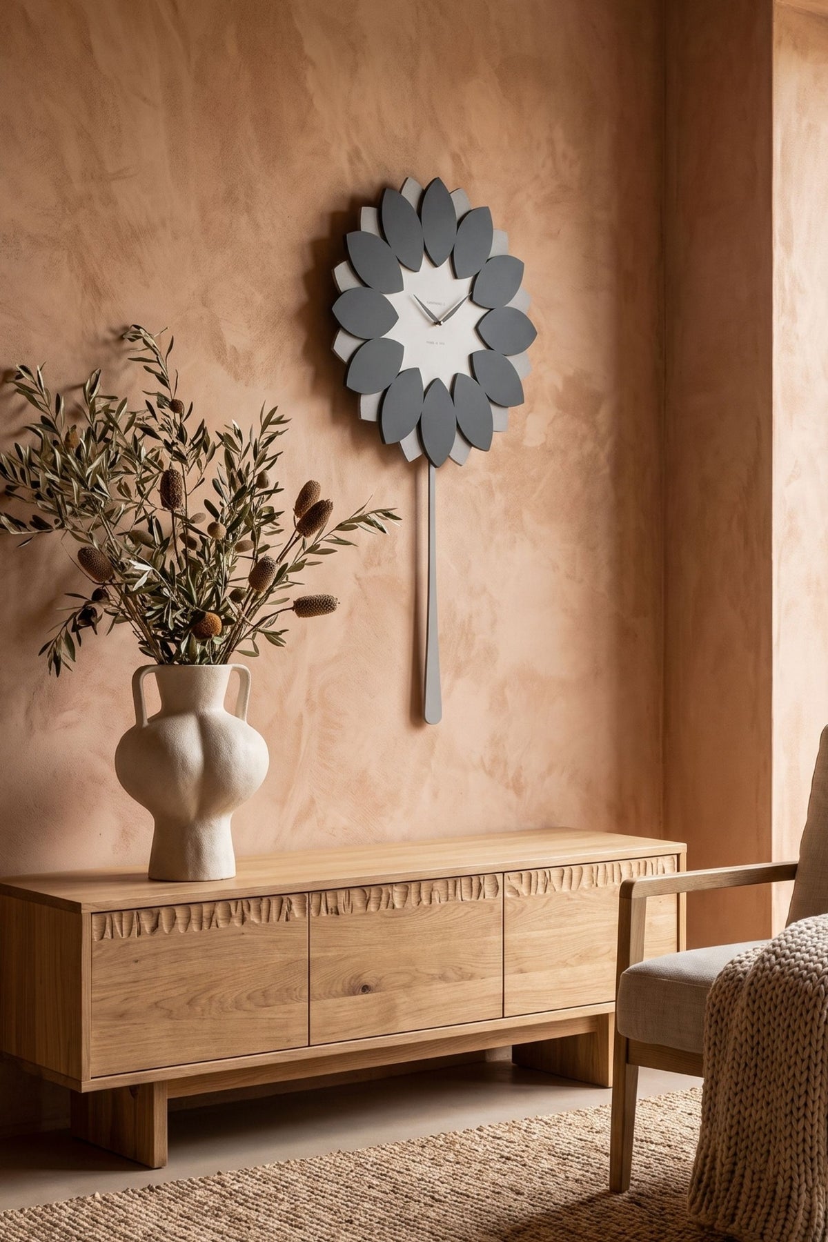 CalleaDesign Flip pendulum clock in Grey Sottsass finish in a warm natural interior
