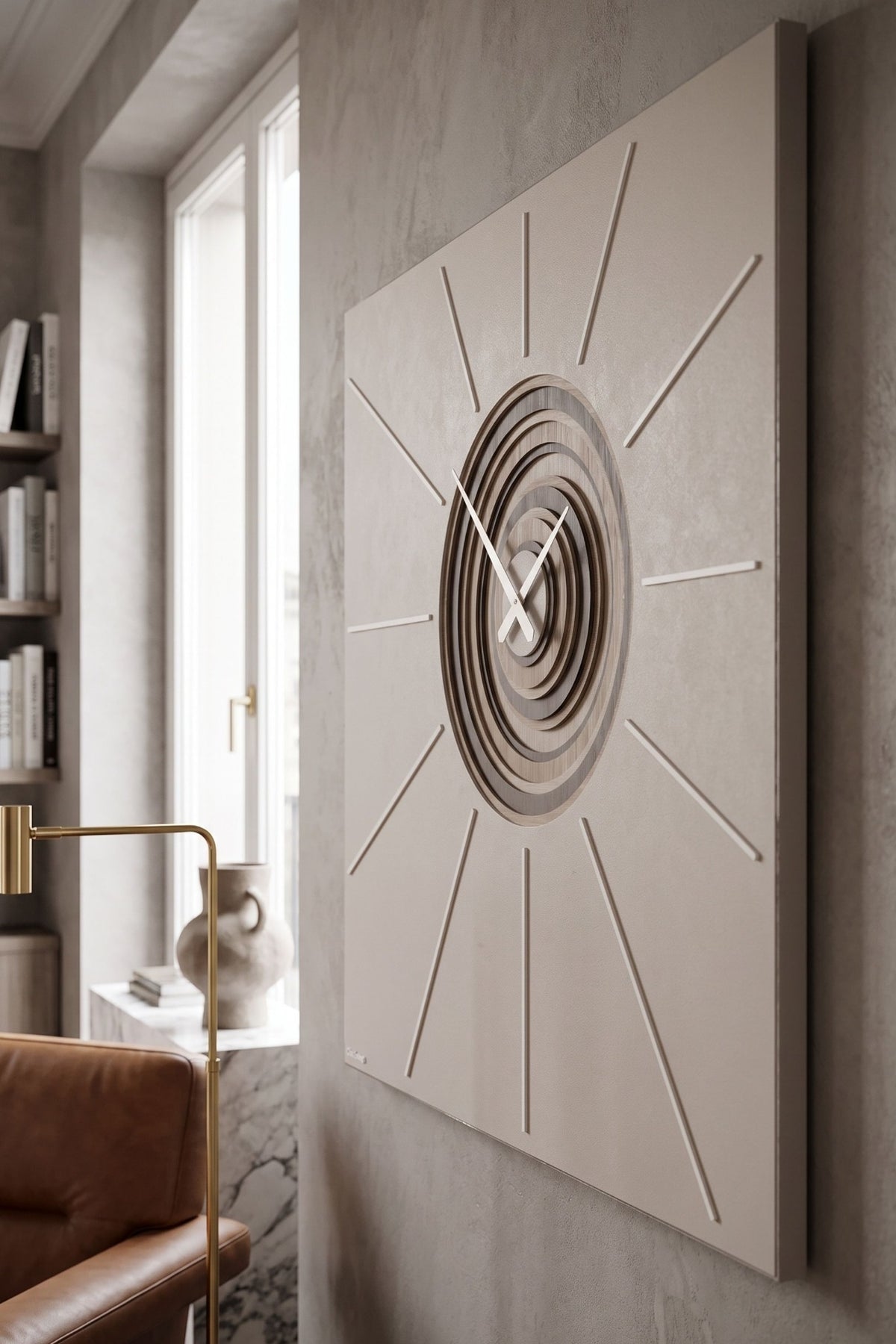 CalleaDesign Helios wall clock in Sand finish, angled side view in a contemporary living room