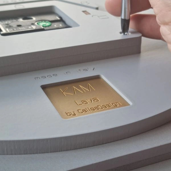 Back of the KAM Lava wall clock showing the engraved CalleaDesign signature and Made in Italy detail