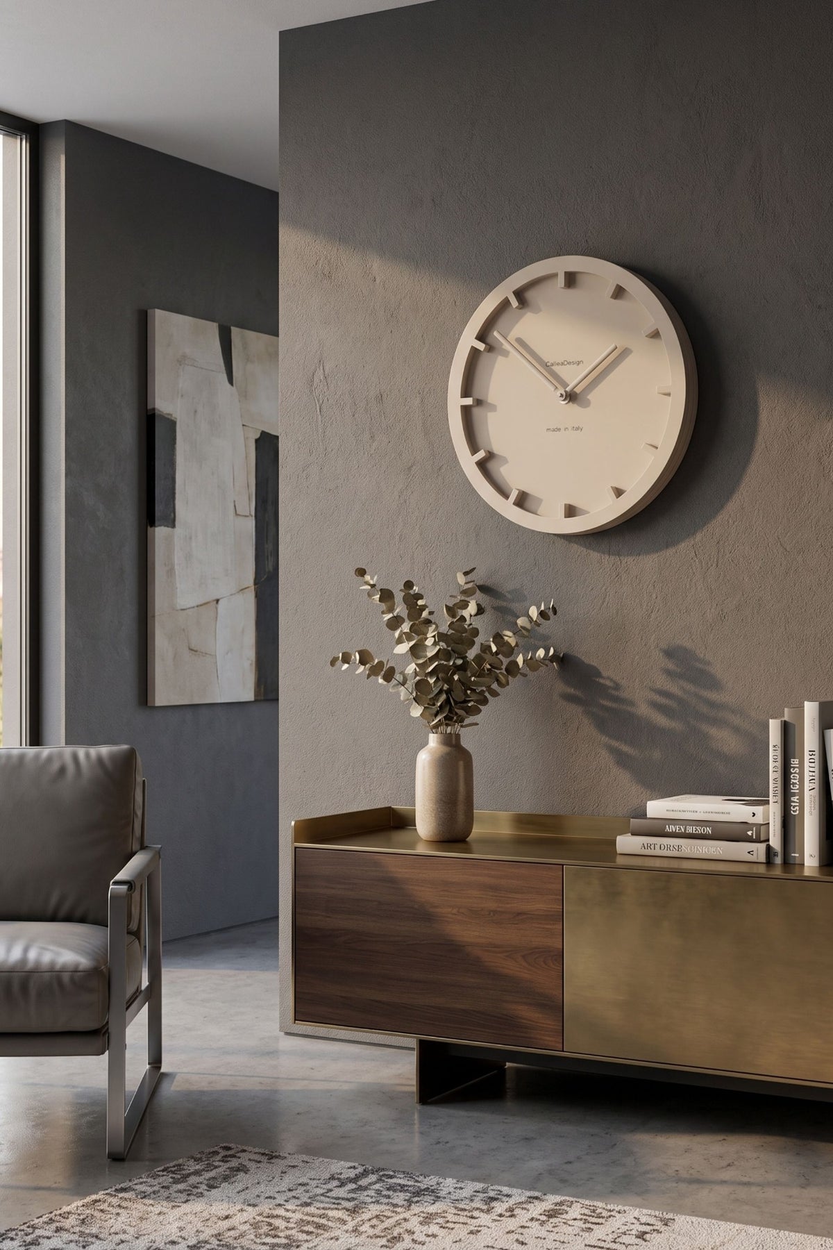 CalleaDesign Mini wall clock in a warm neutral finish in a contemporary living room
