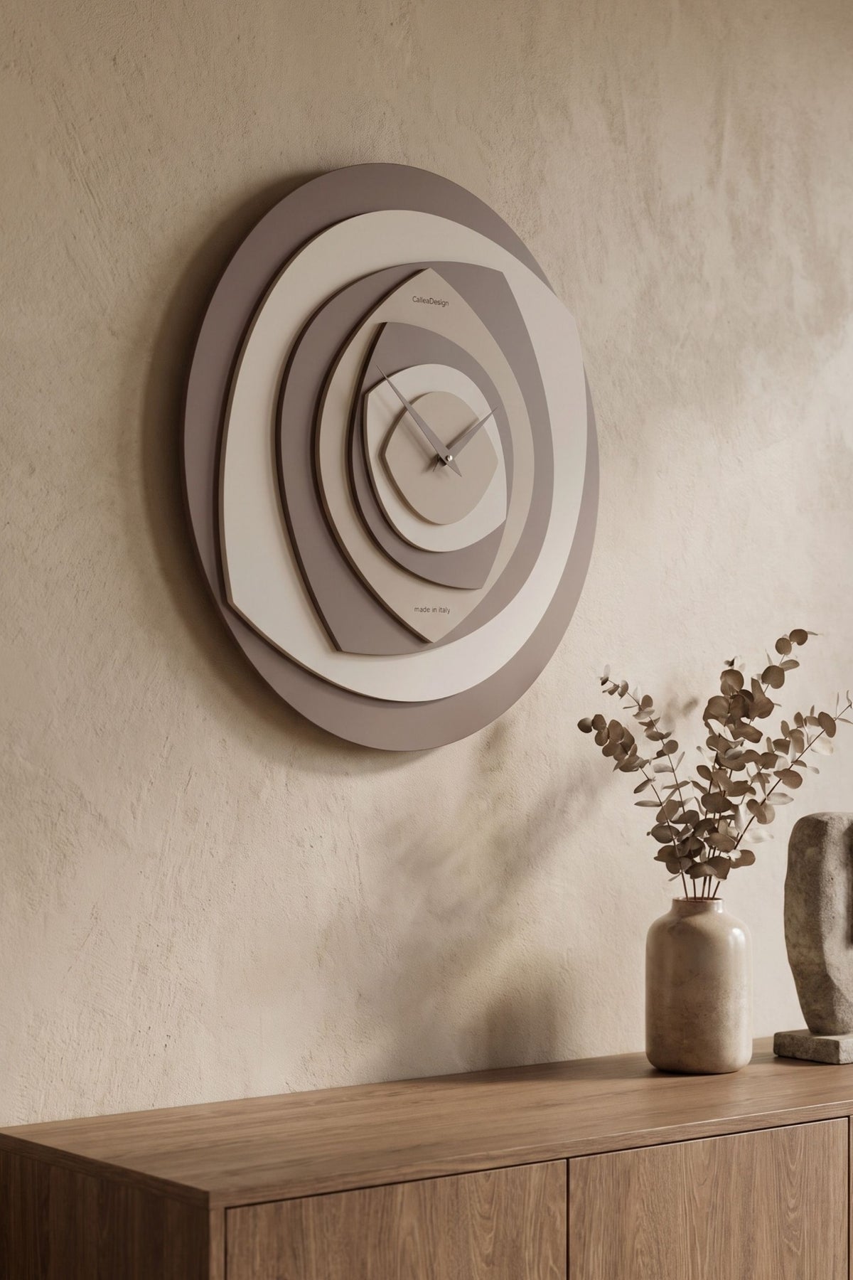 Side view of CalleaDesign Petalo wall clock in Chocolate finish showing its layered design