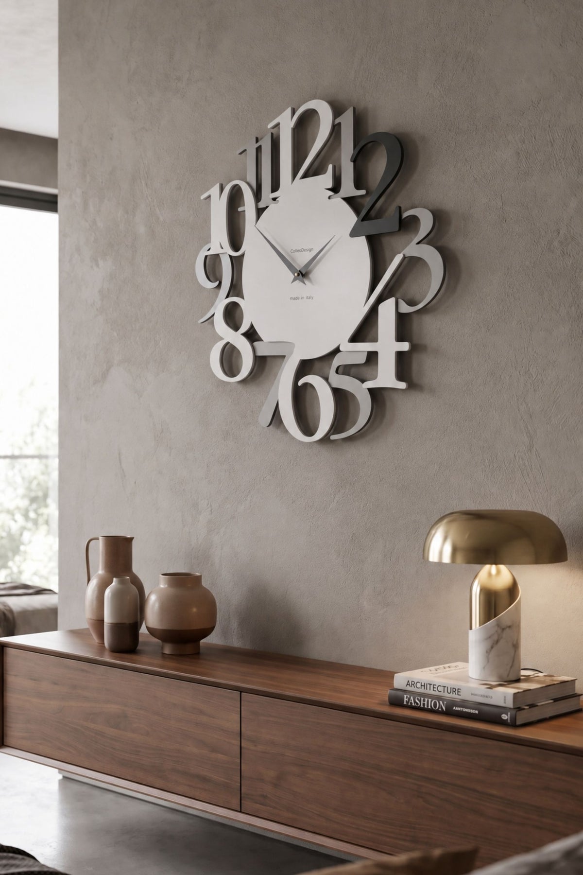 CalleaDesign Russell wall clock in Black finish in a contemporary interior